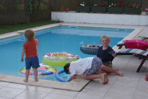 Jame Alistair and Arthie around the pool